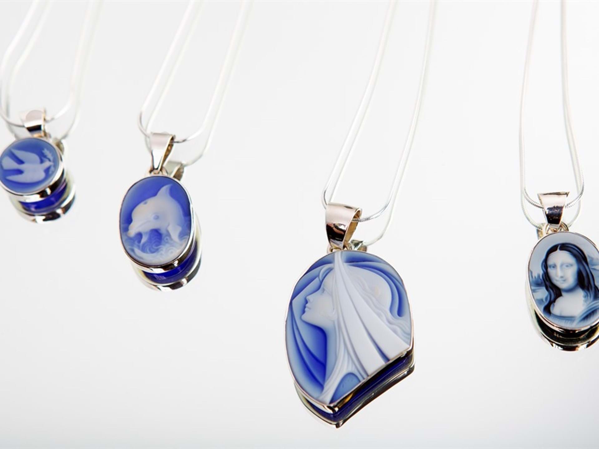 Carved agate cameo necklaces available at Glassando