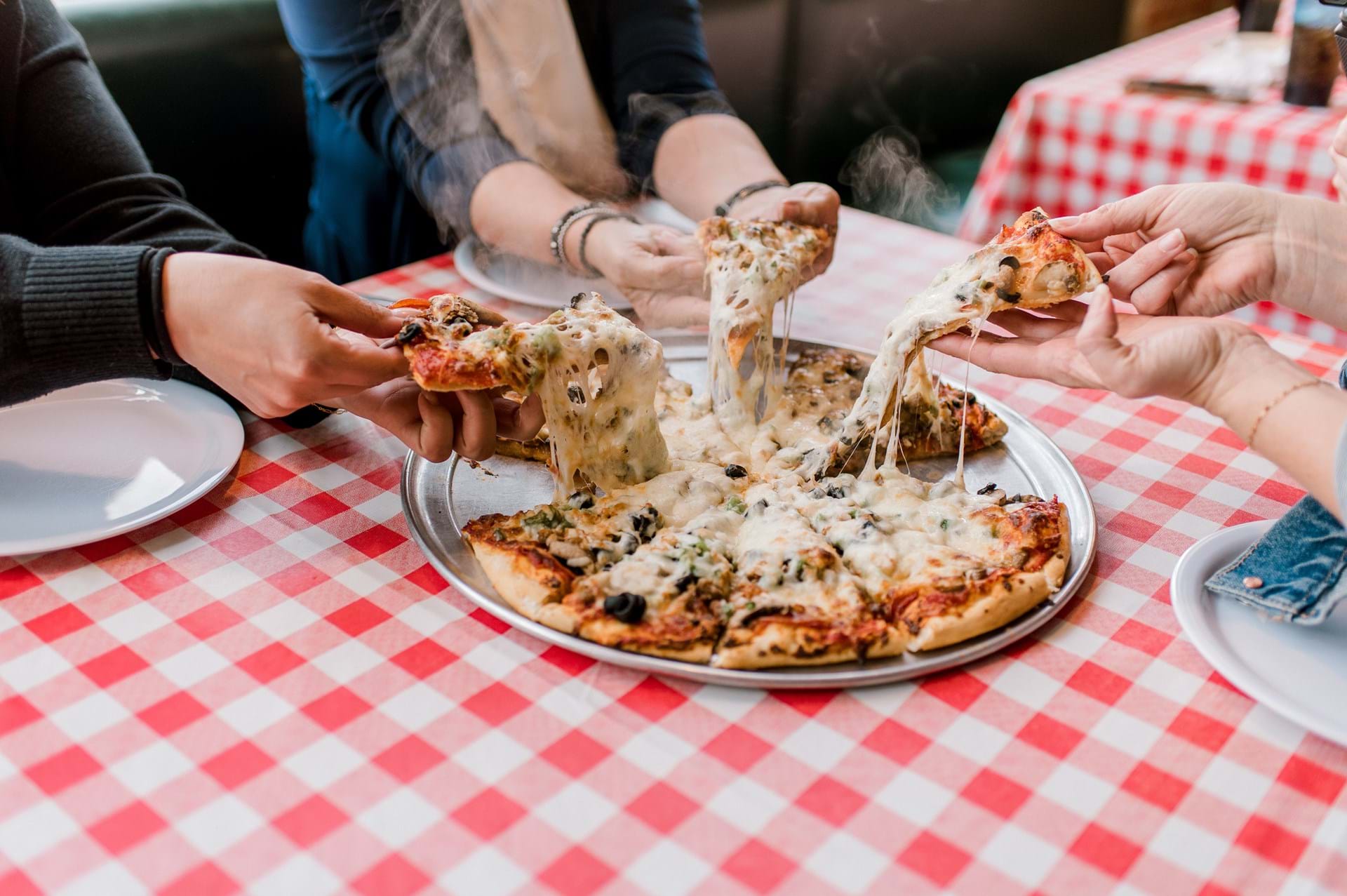 Fresh hot pizza at Herb N Lou's